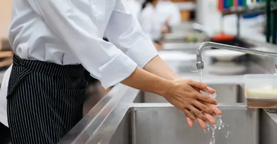 A chef washing their hands